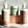 Nourishing and defining hair care for curls, waves, and coils. Curl Flo conditioner, curl cream, and hair mask displayed with a Curls Allowed box on a marble surface.